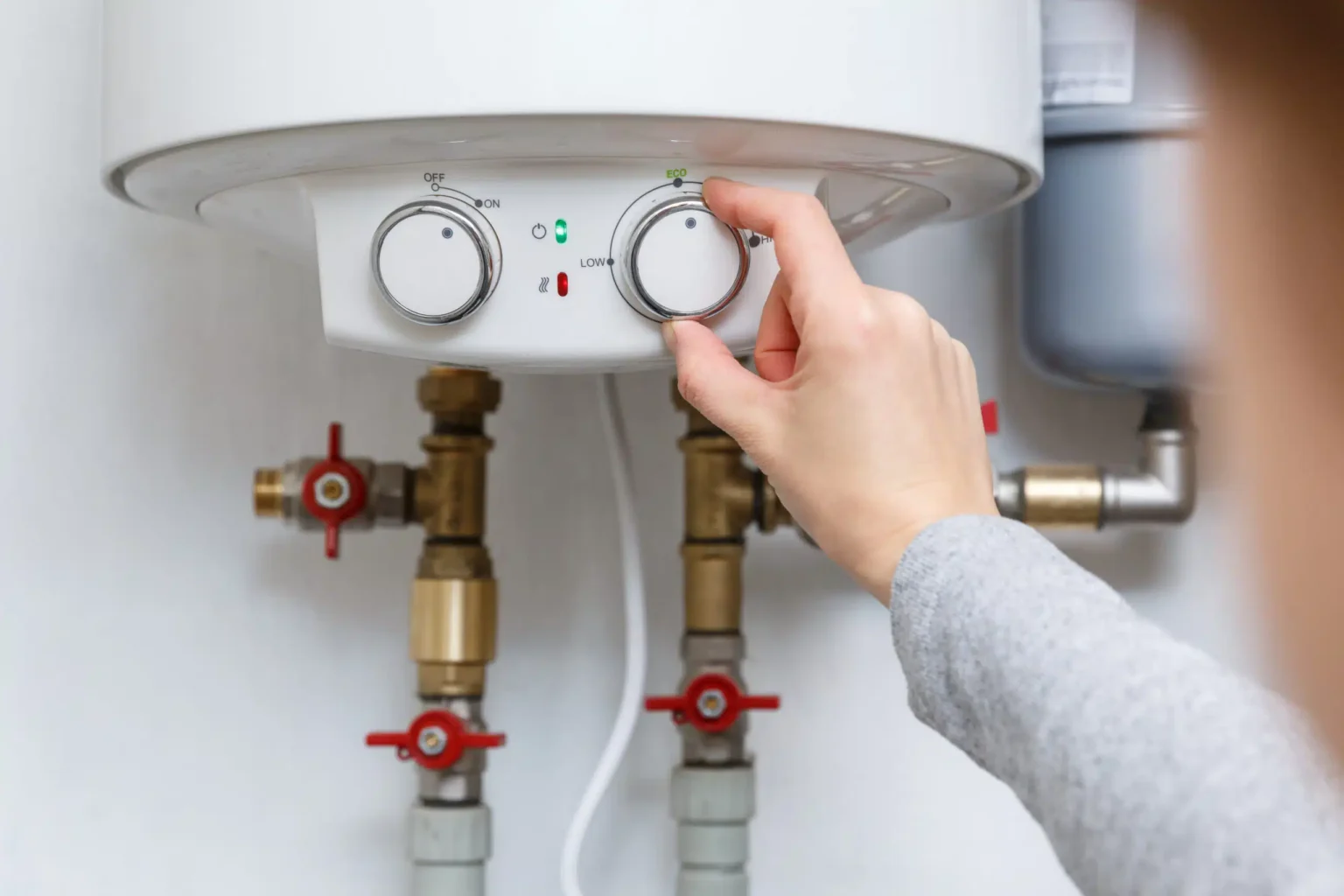 Technician adjusting a water heater in Belmont
